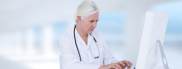 Female Doctor using Netsmart RxConnect to Prescribe Medication